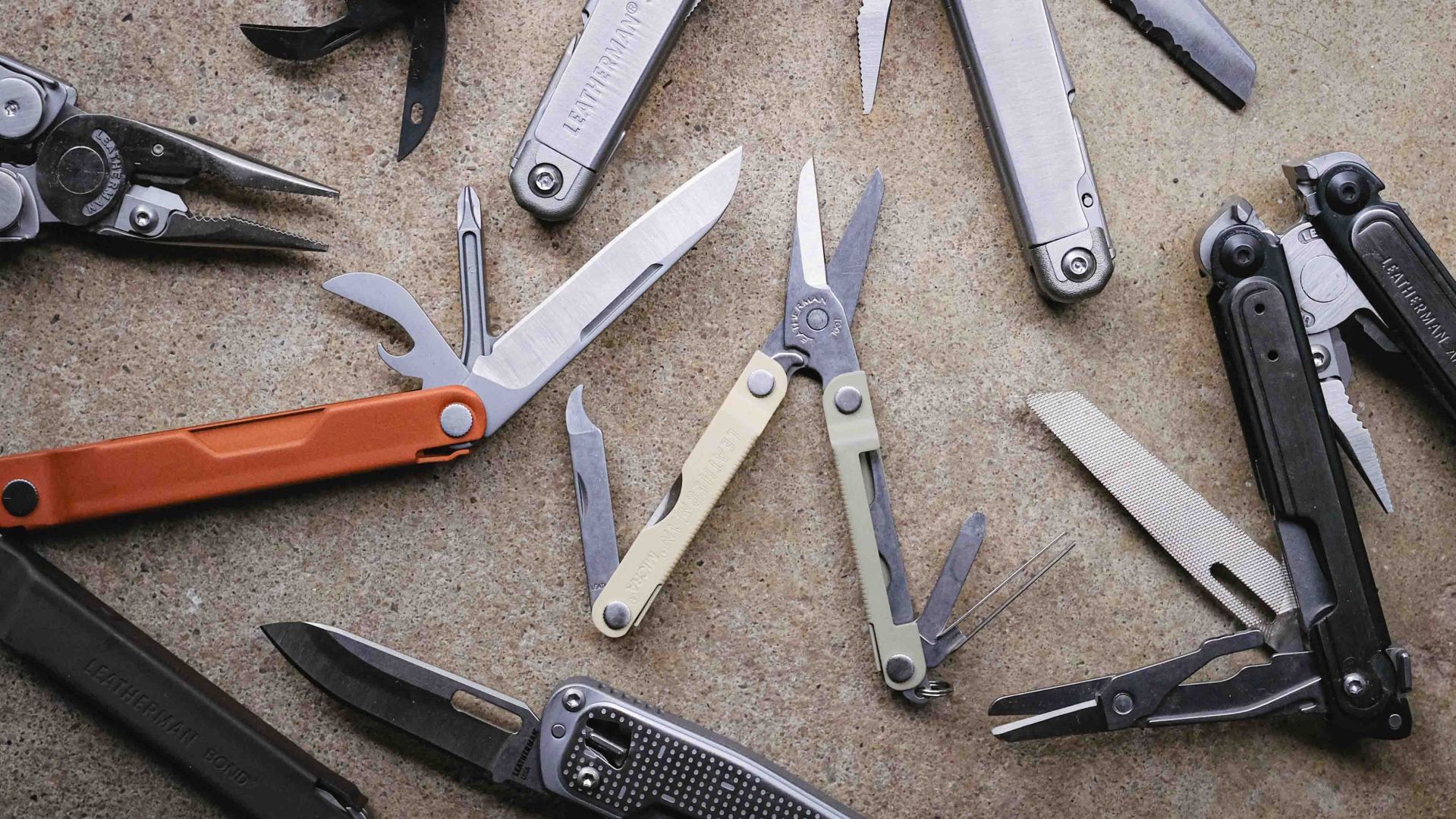 Leatherman multi-tools arranged on concrete