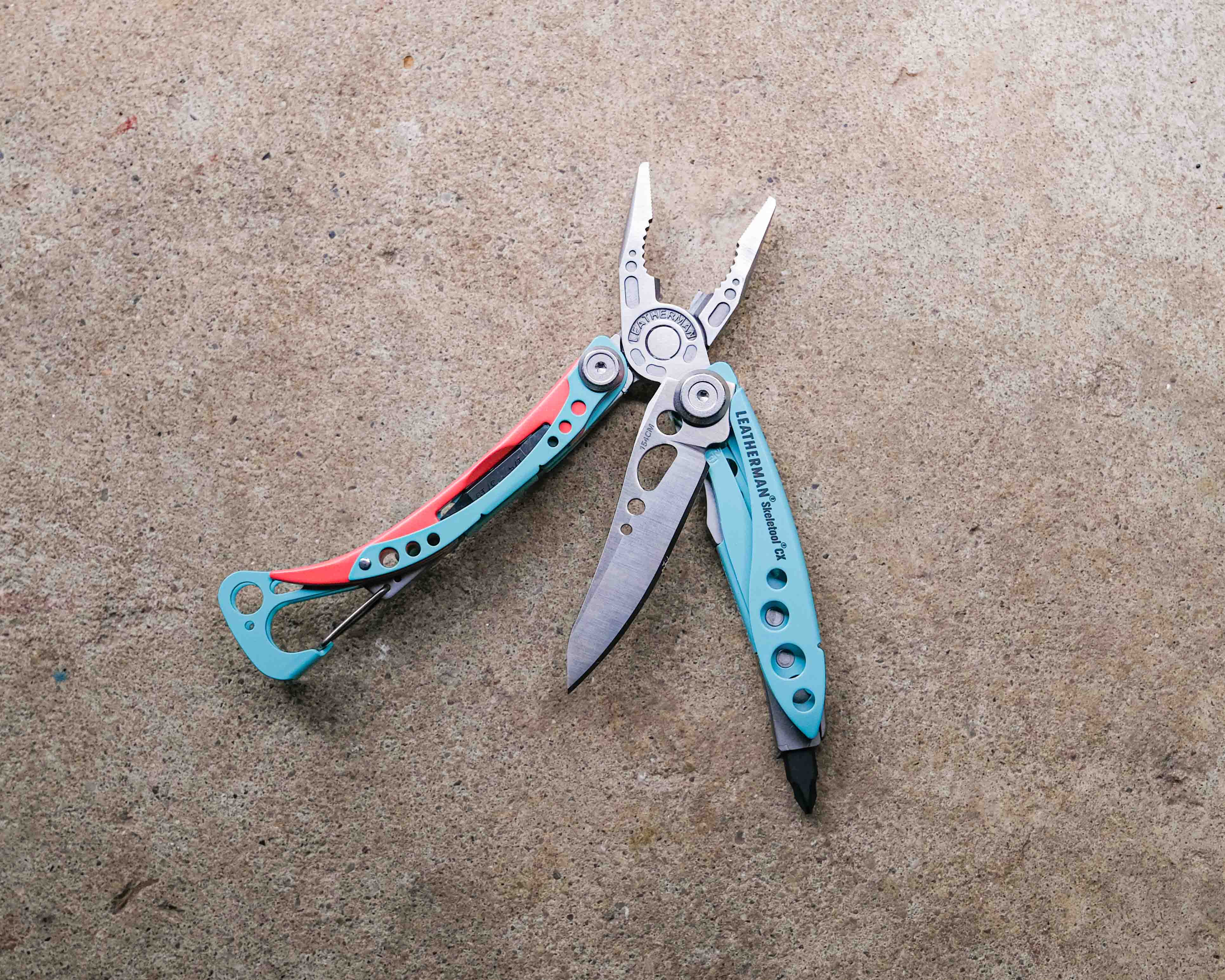 Leatherman multi-tool on concrete backdrop