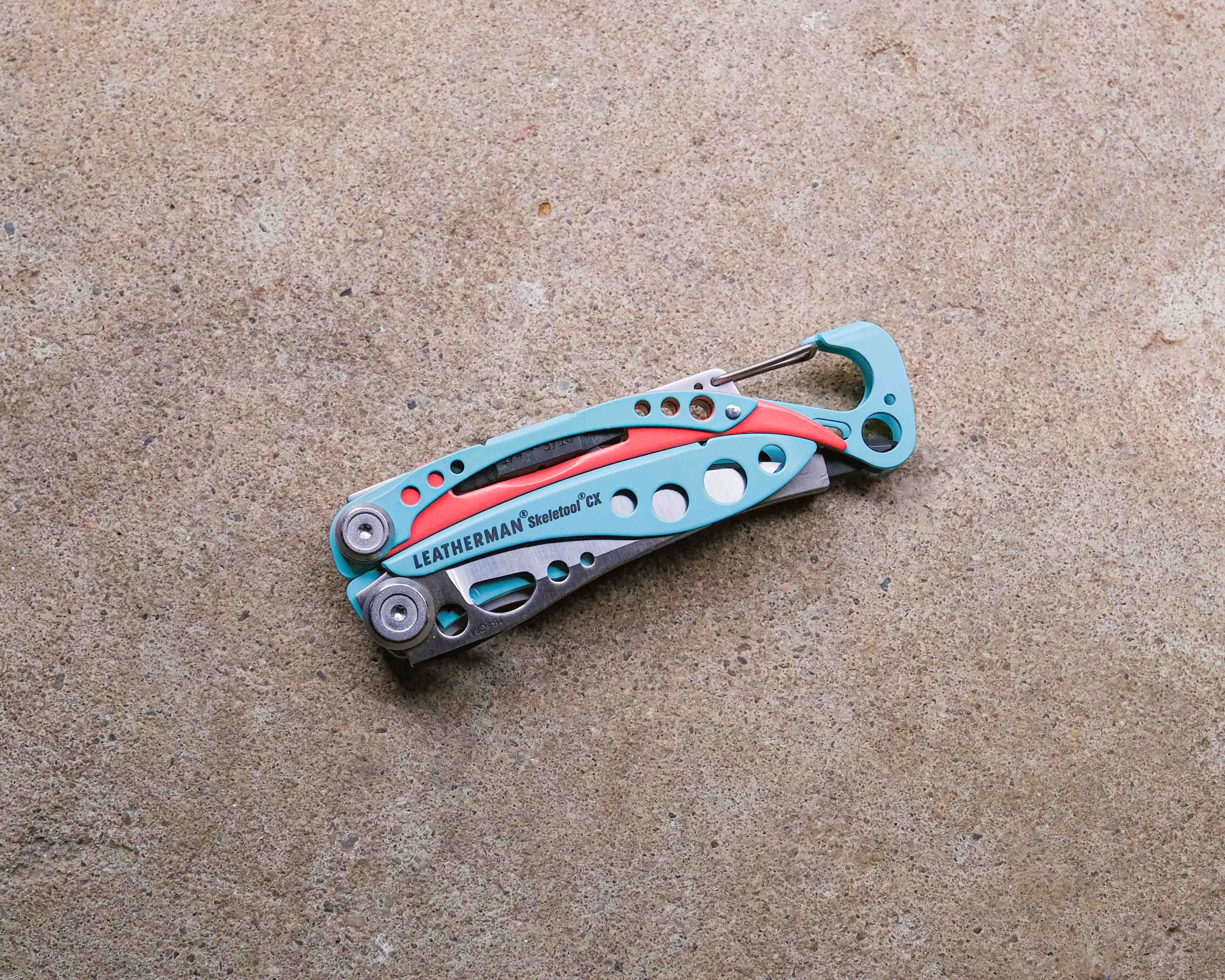 Leatherman multi-tool on concrete backdrop