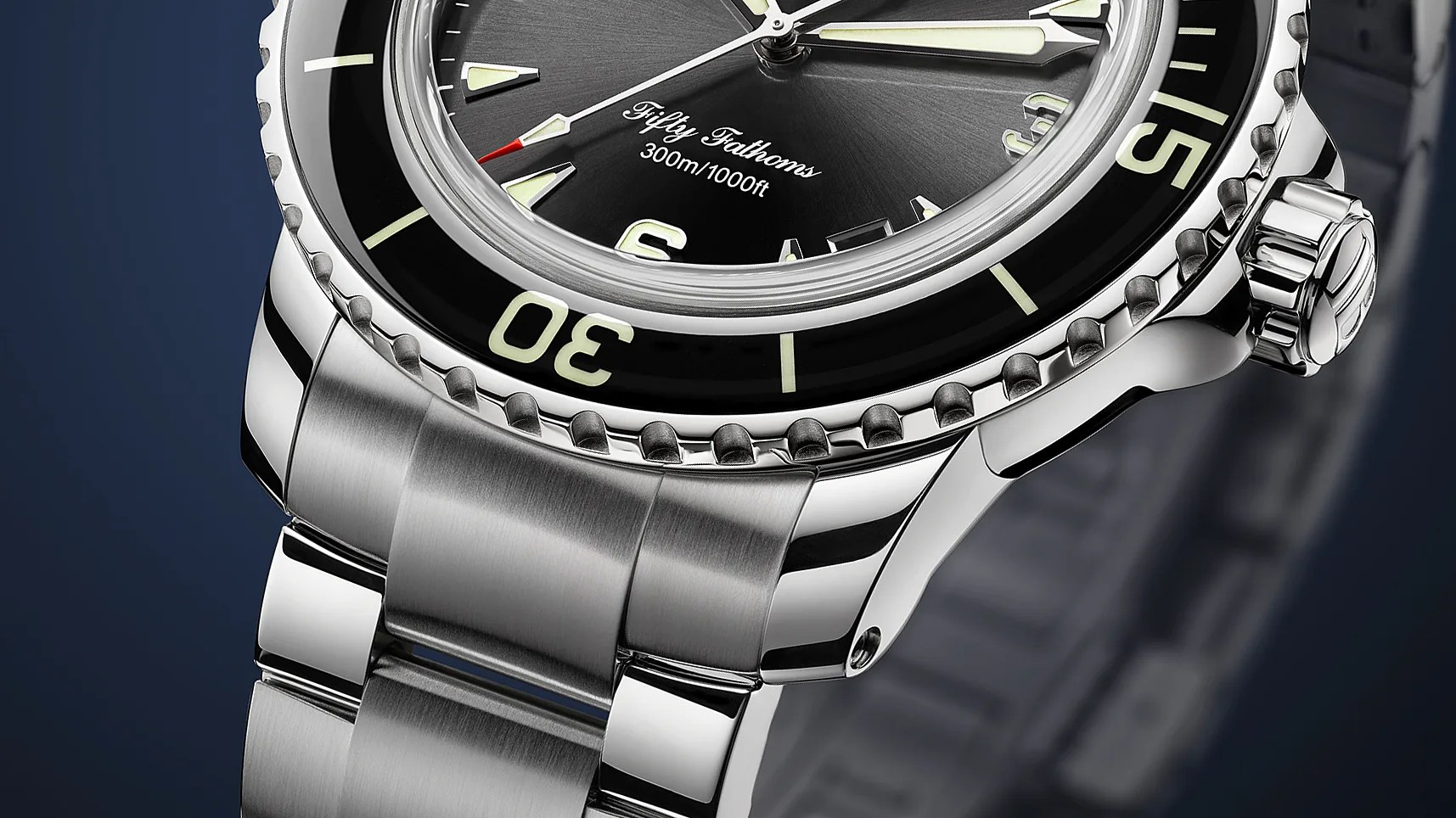 a close up view of a Blancpain dive watch with a black dial