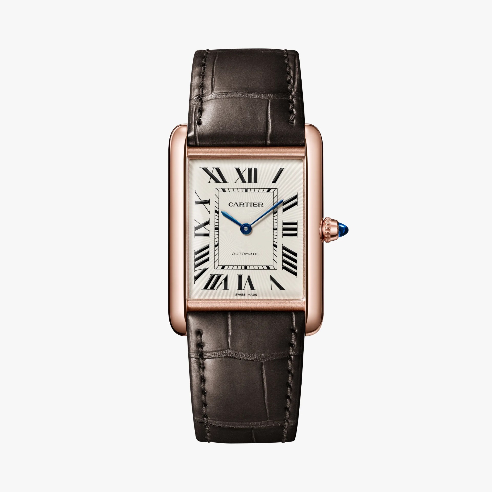 a rose gold rectangular Cartier watch with a brown leather stap