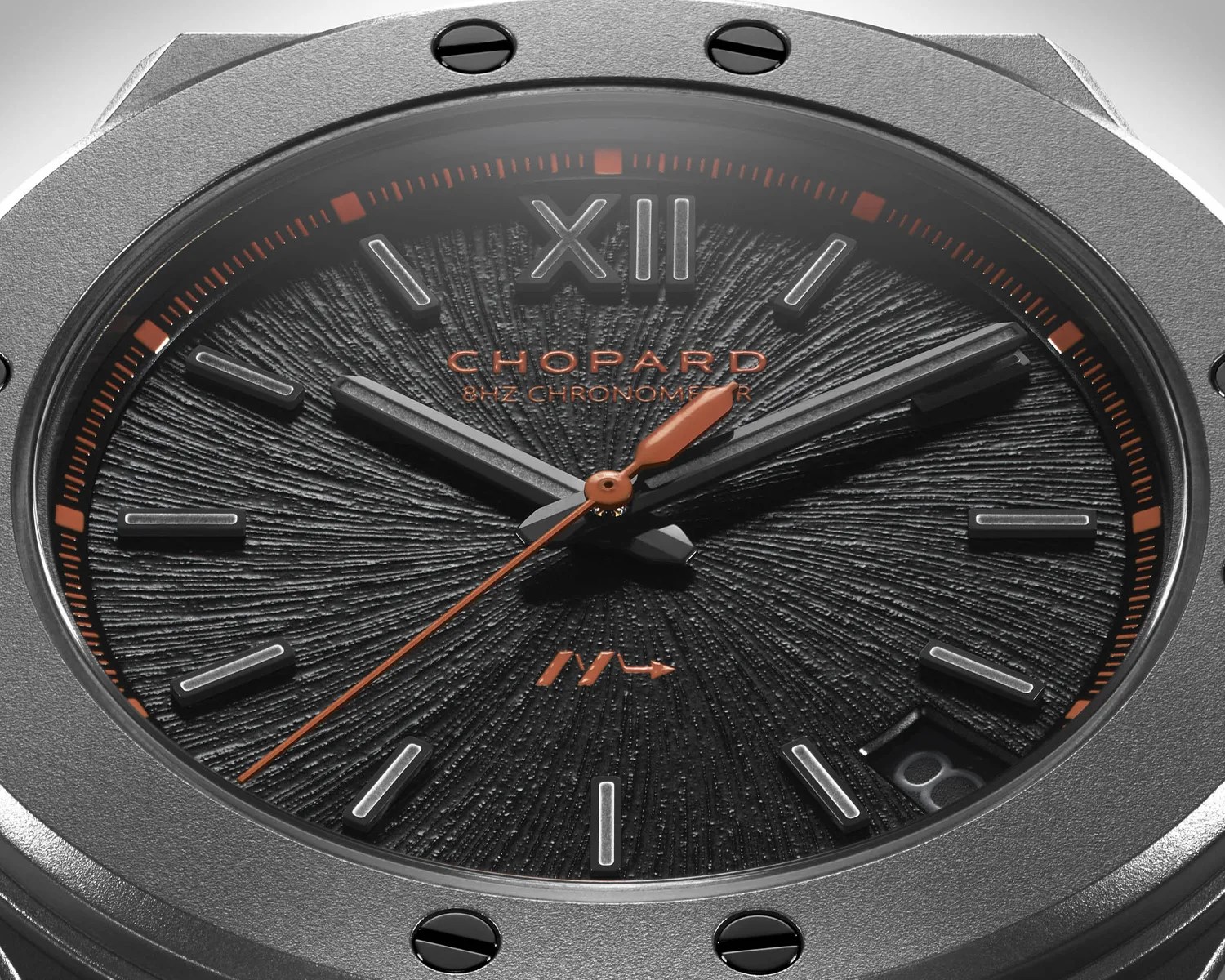 a closeup of a black chopard watch dial
