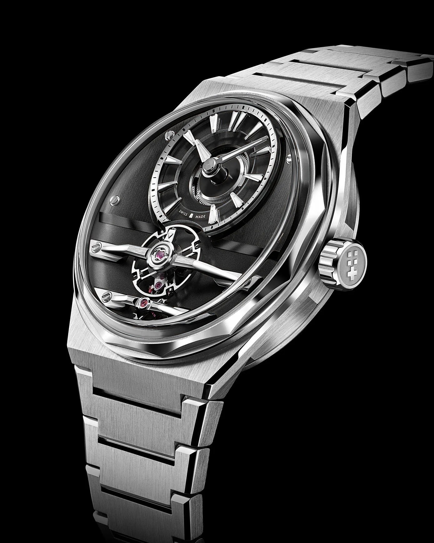 a steel Christopher Ward sports watch with a black dial
