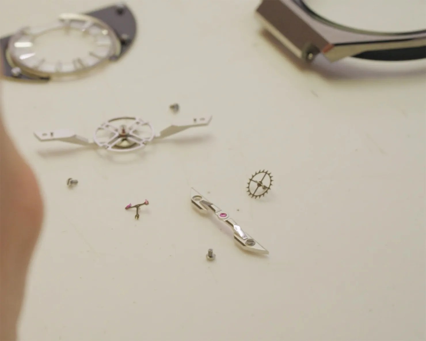 watch movement parts on a desk