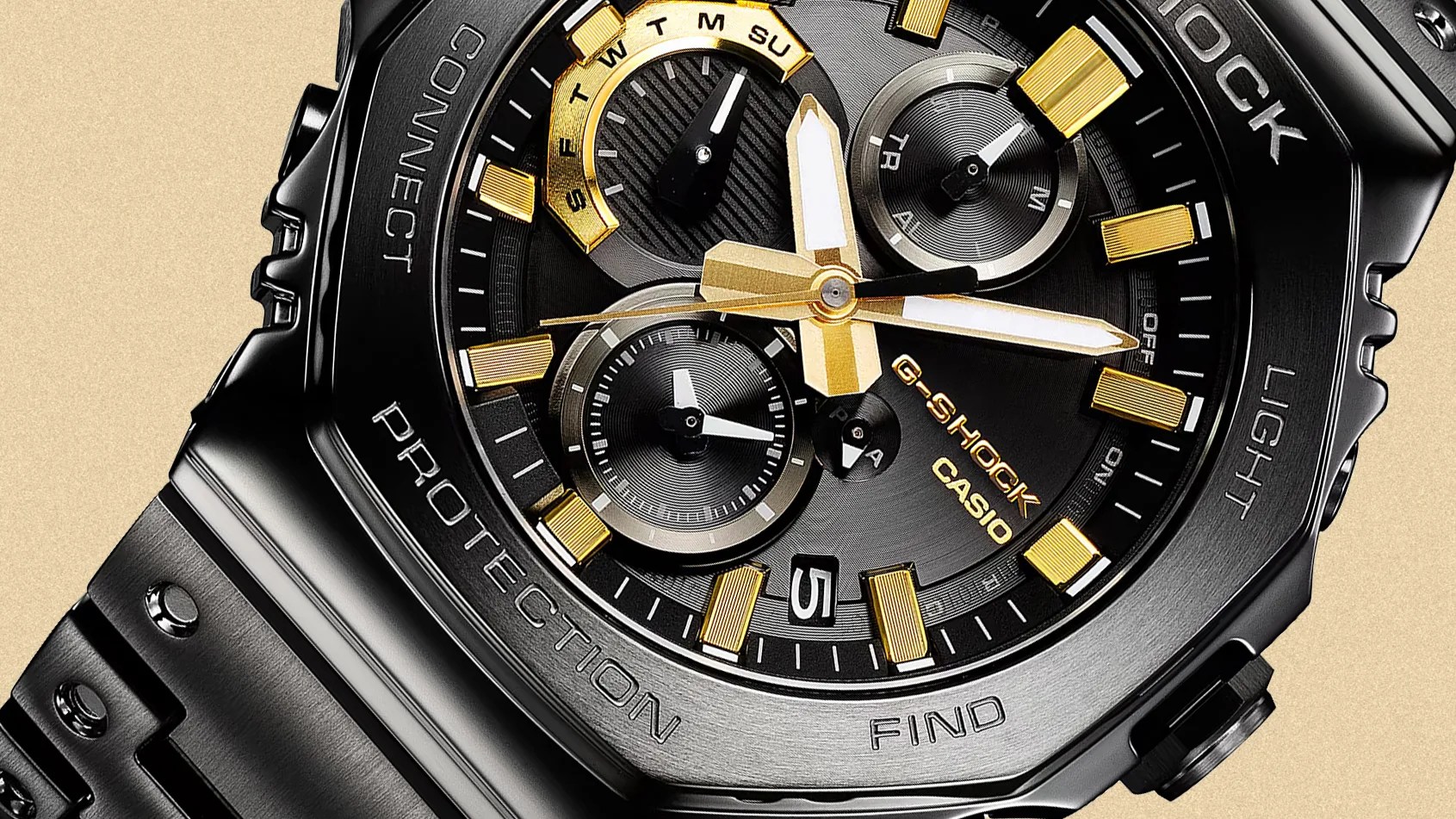 a black g-shock watch dial with gold hands and hour markers