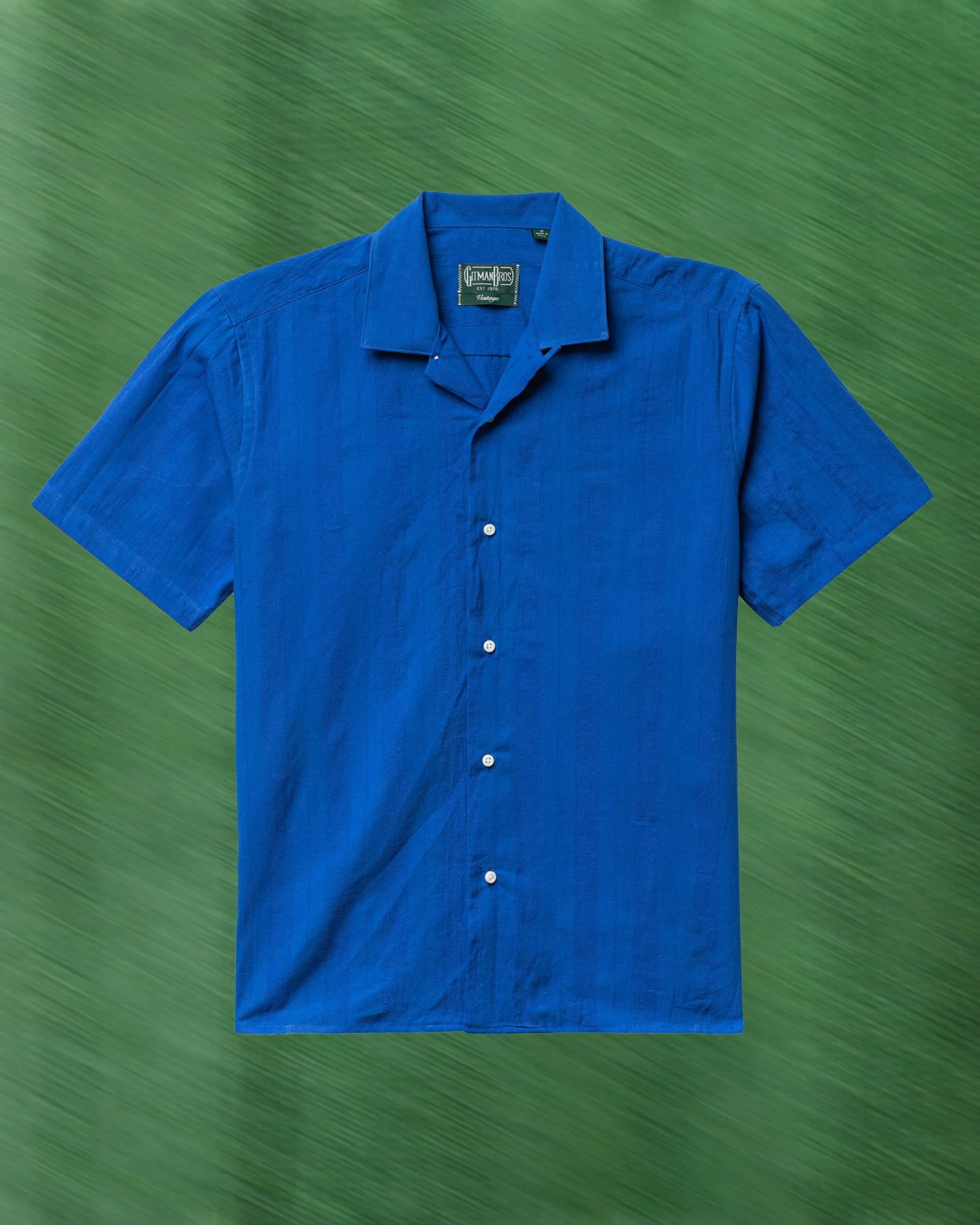 a light blue camp collar shirt