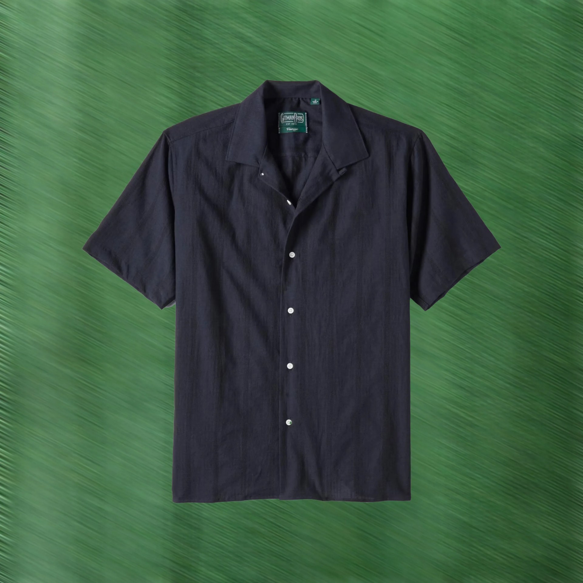 a navy blue camp collar shirt