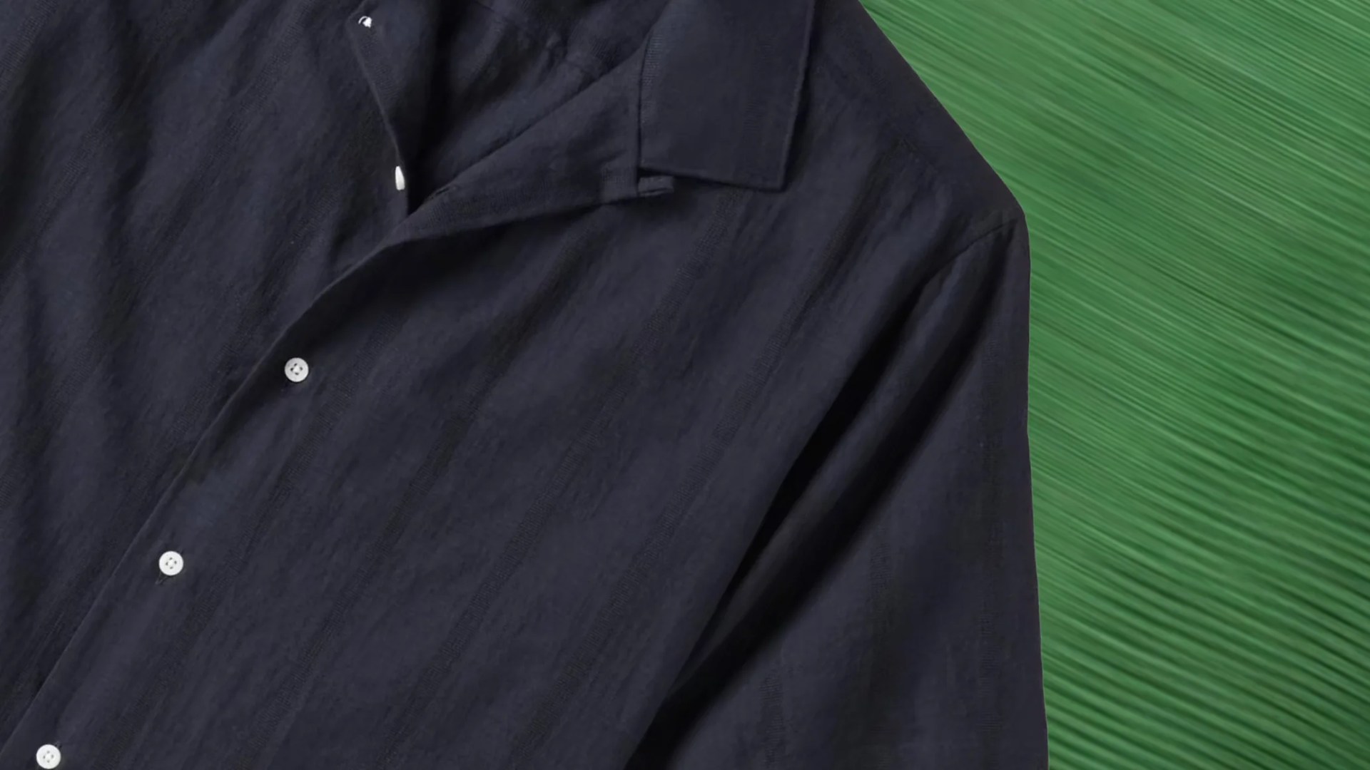 a navy blue camp collar shirt