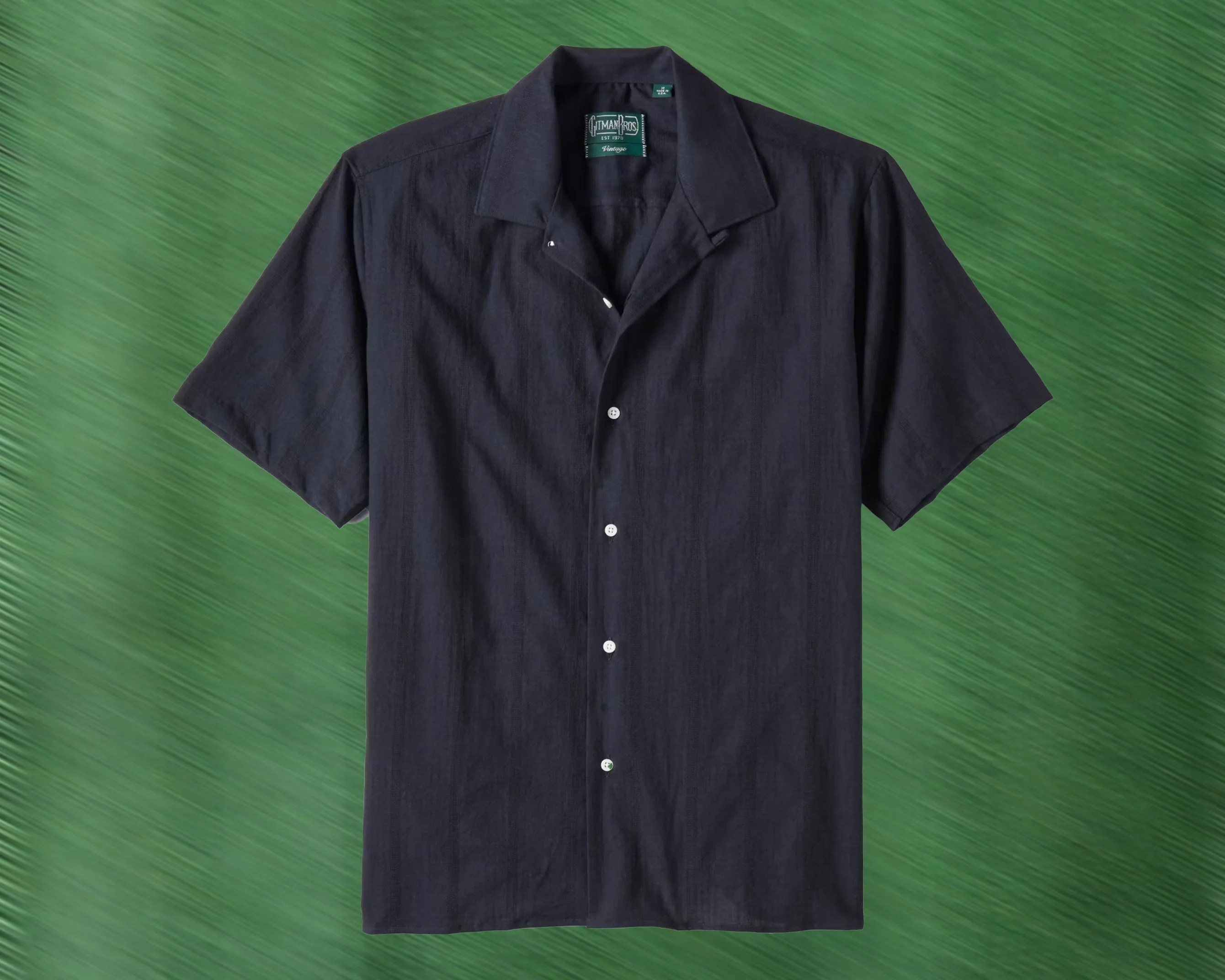 a navy blue short sleeve camp collar shirt
