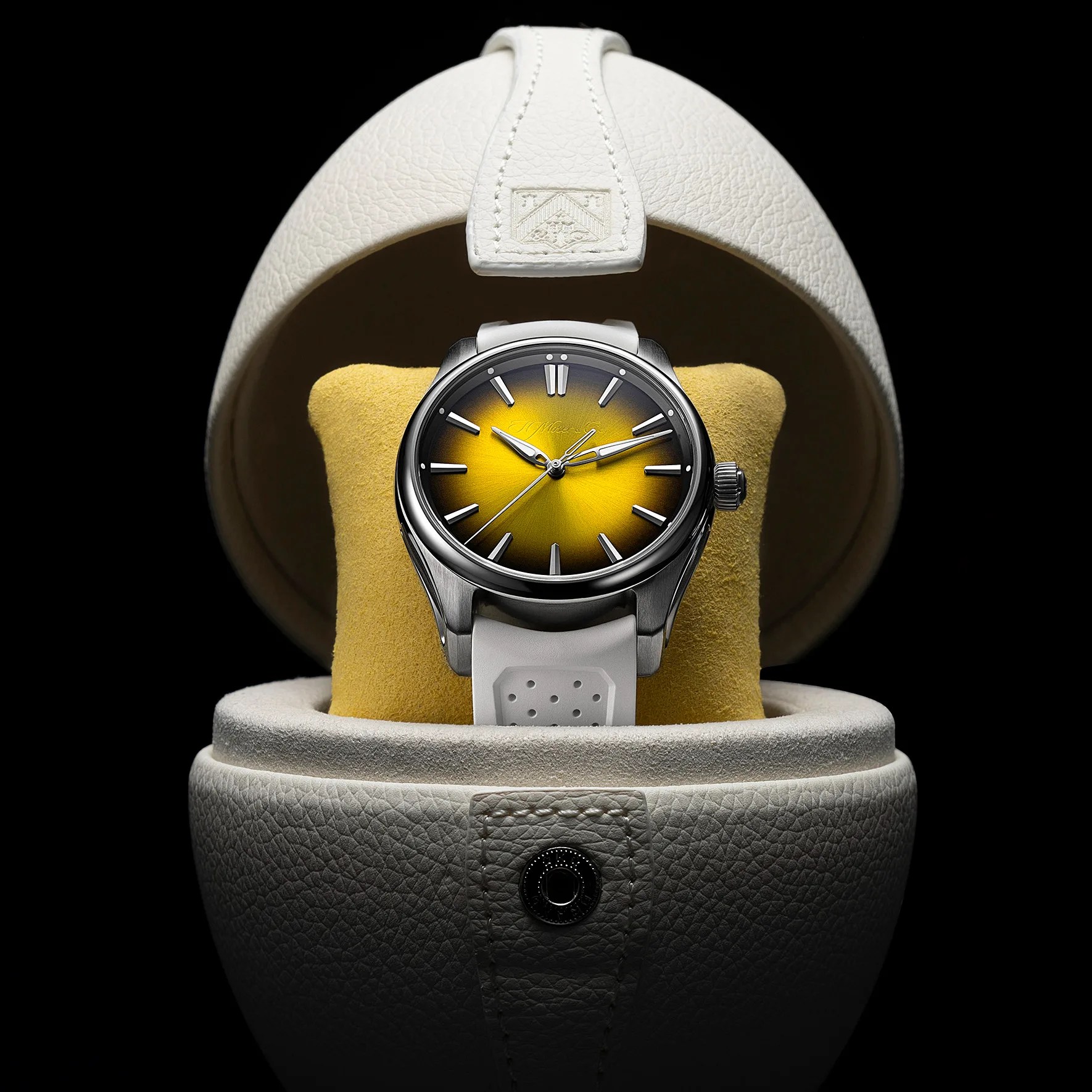 a yellow dial watch in an egg-shaped case
