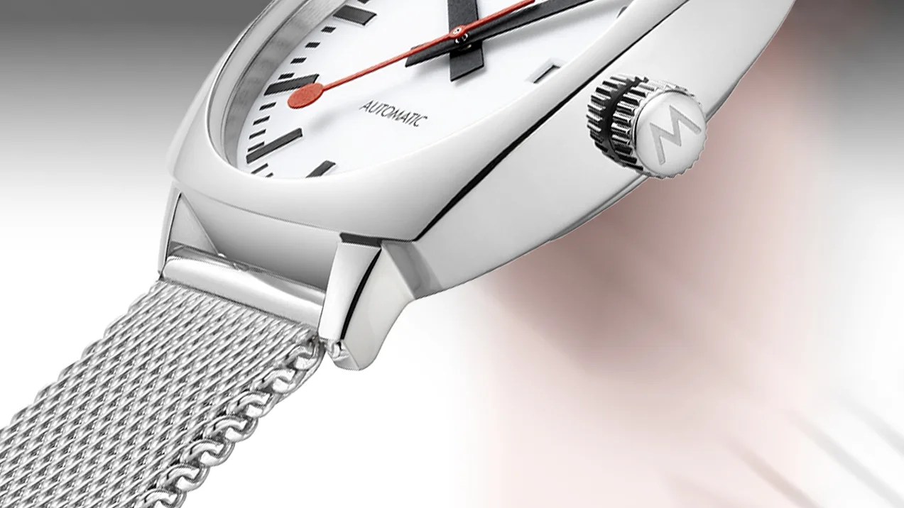 a steel Mondaine watch with a white dial