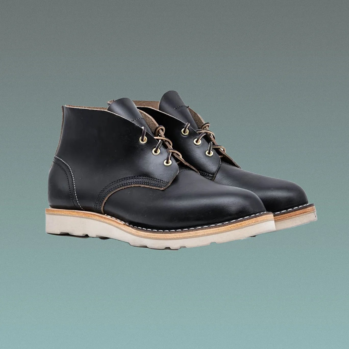 a pair of black leather chukka boots