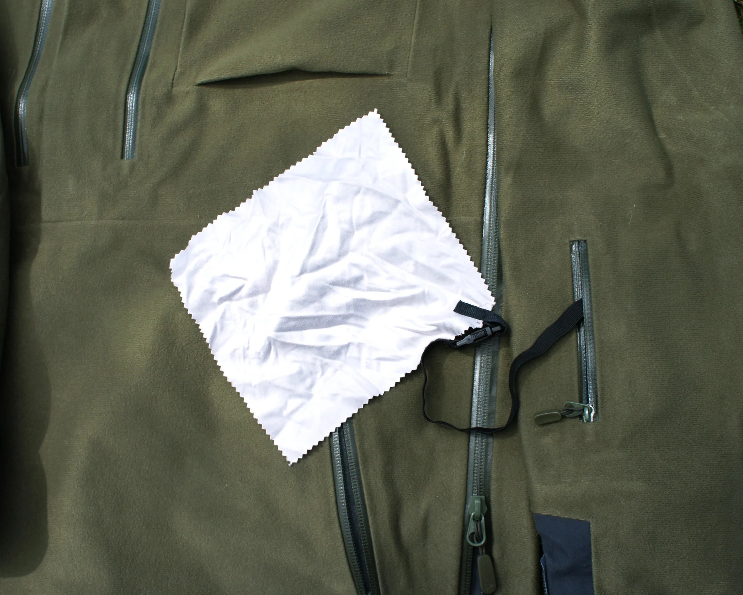 a jacket sleeve with a goggle wipe attached