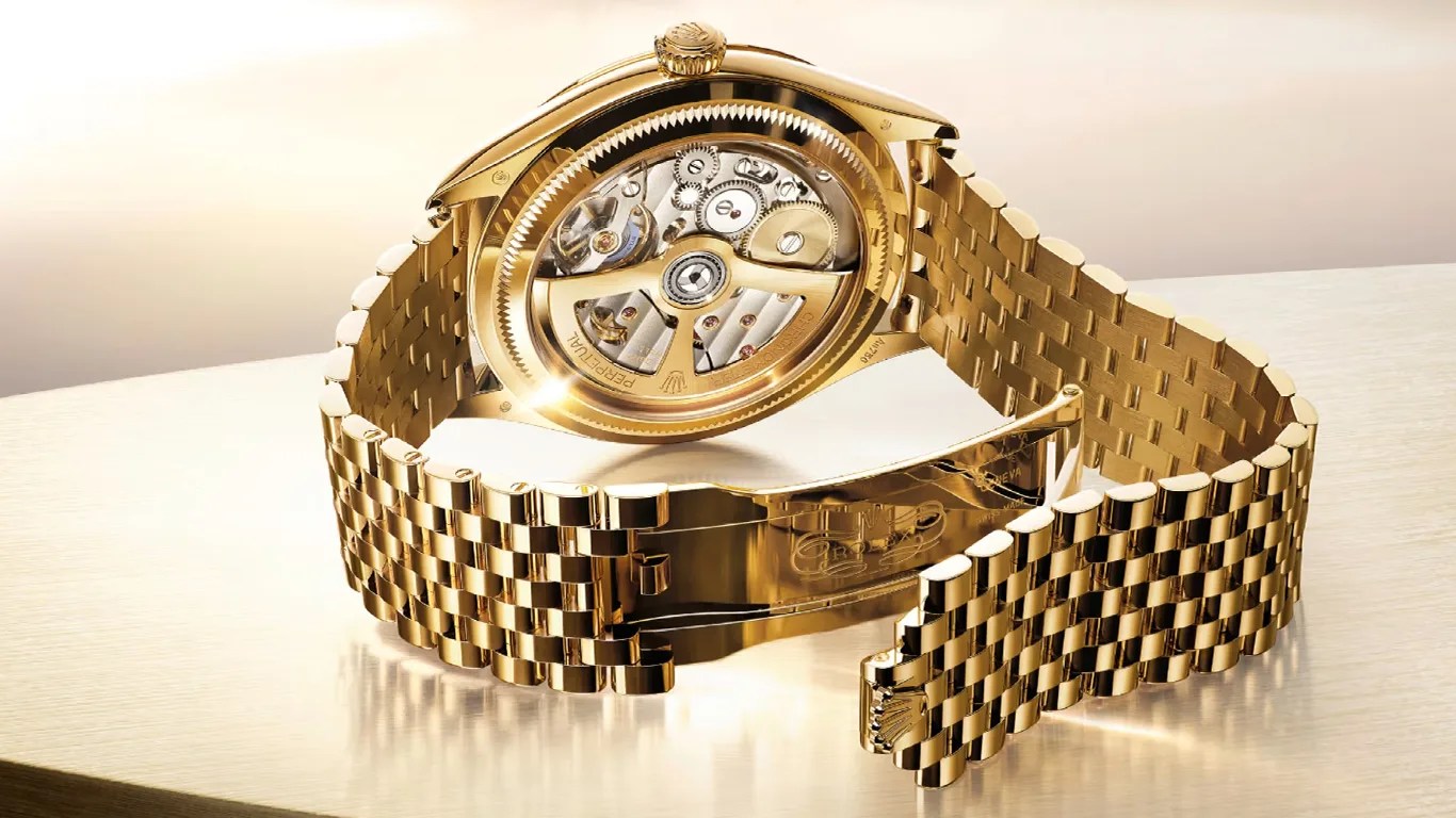 a gold rolex watch on a bracelet