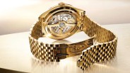 a gold rolex watch on a bracelet