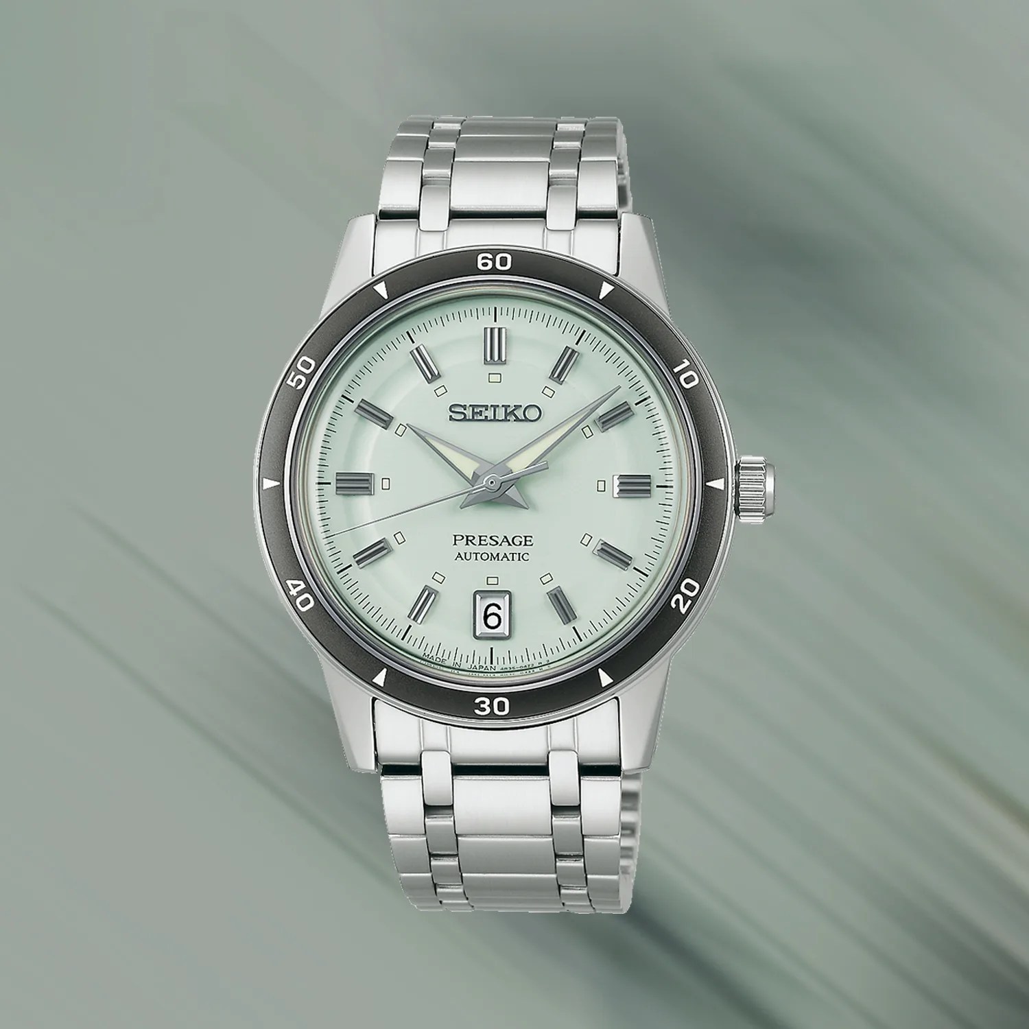 a Seiko watch with a green dial
