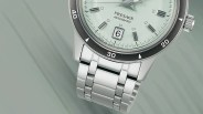 a Seiko watch with a green dial and steel bracelet