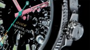 a black watch dial under water