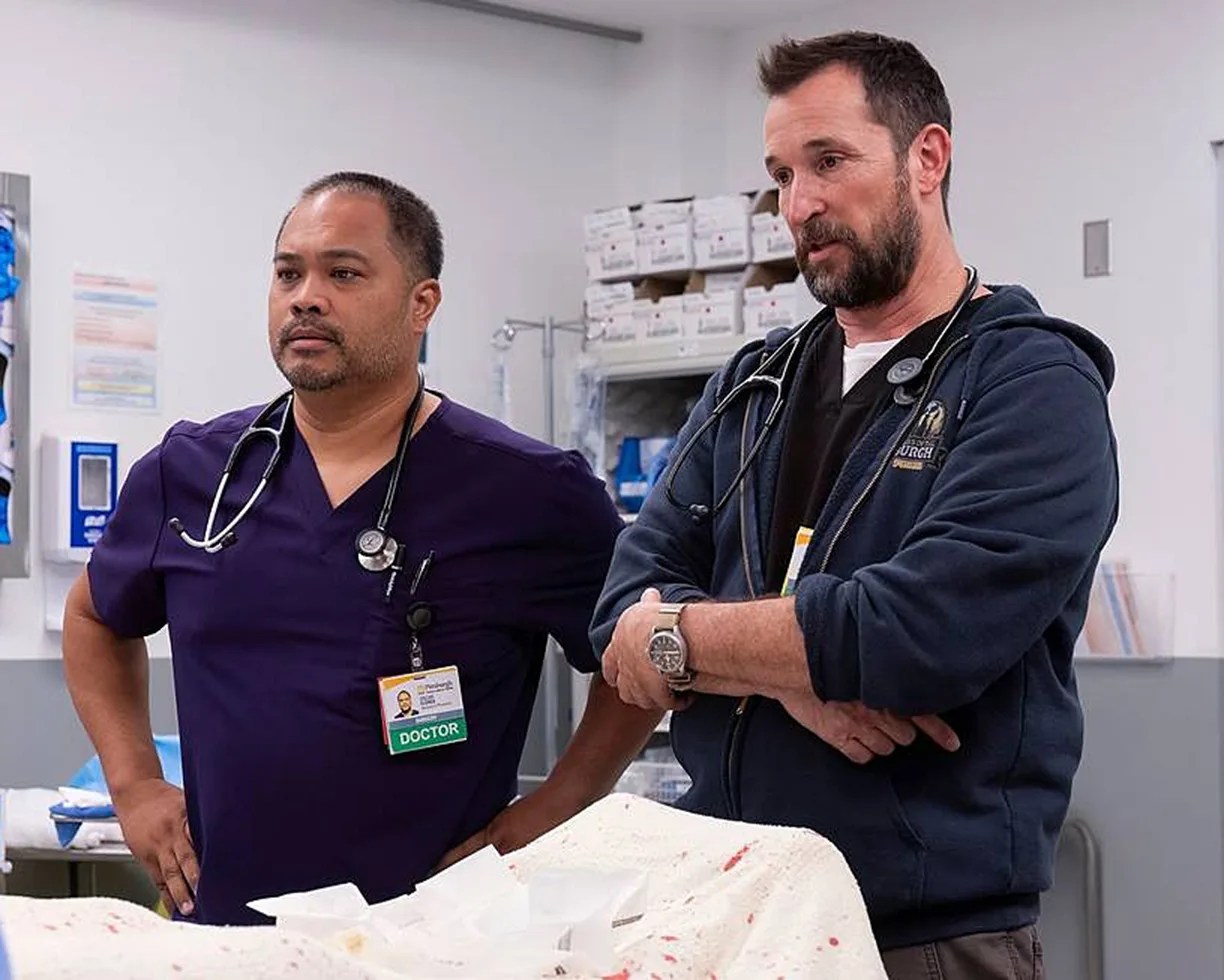 a nurse and doctor standing next to eachother
