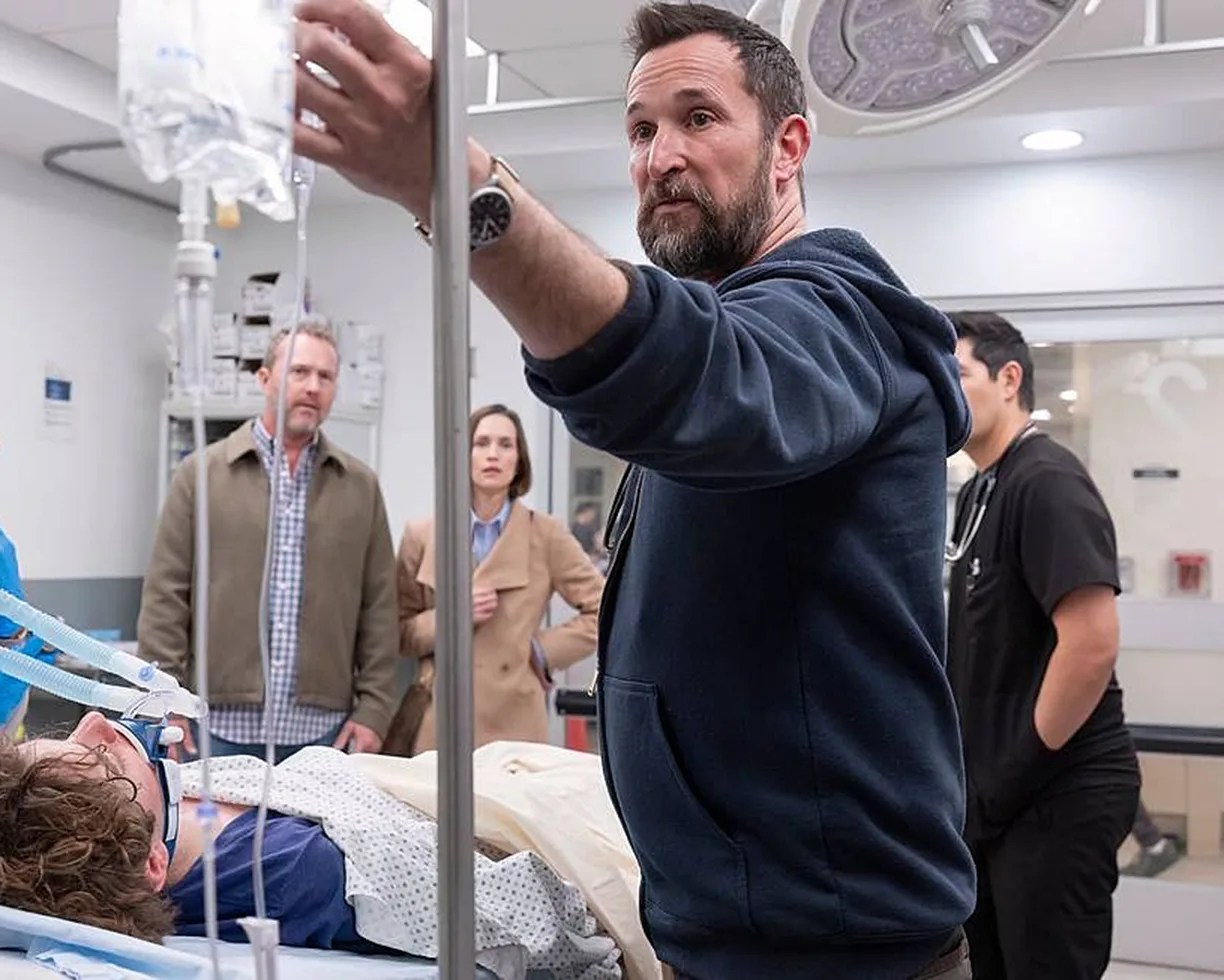 a doctor in a blue hoodie