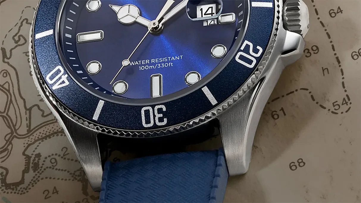 the dial, bezel and case of a watch laying on a map