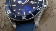the dial, bezel and case of a watch laying on a map