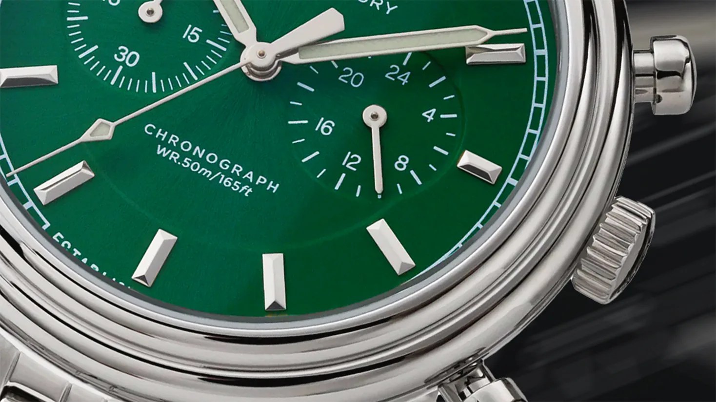the dial of a green Timex chronograph watch