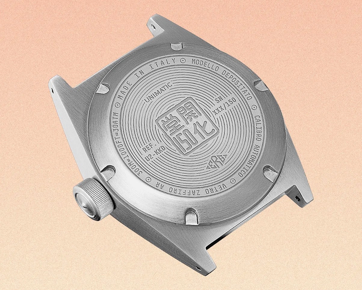 a watch case back with a japanese logo on it