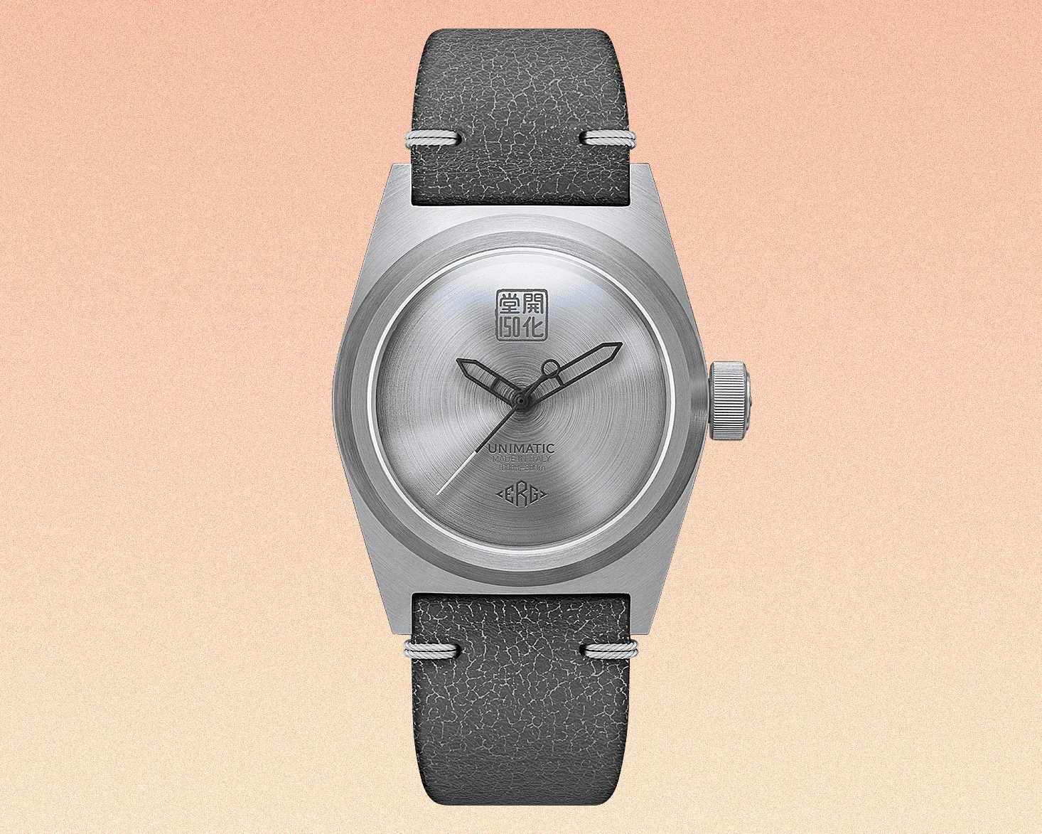a silver dial watch with a gray strap
