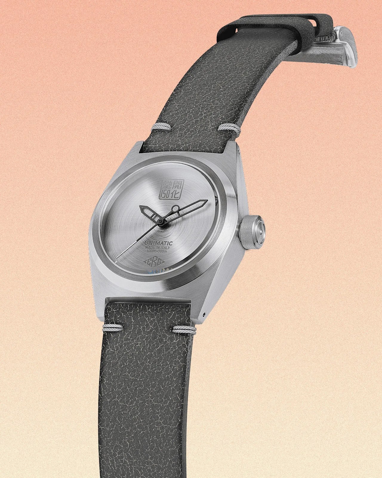 a silver dial watch with a gray strap