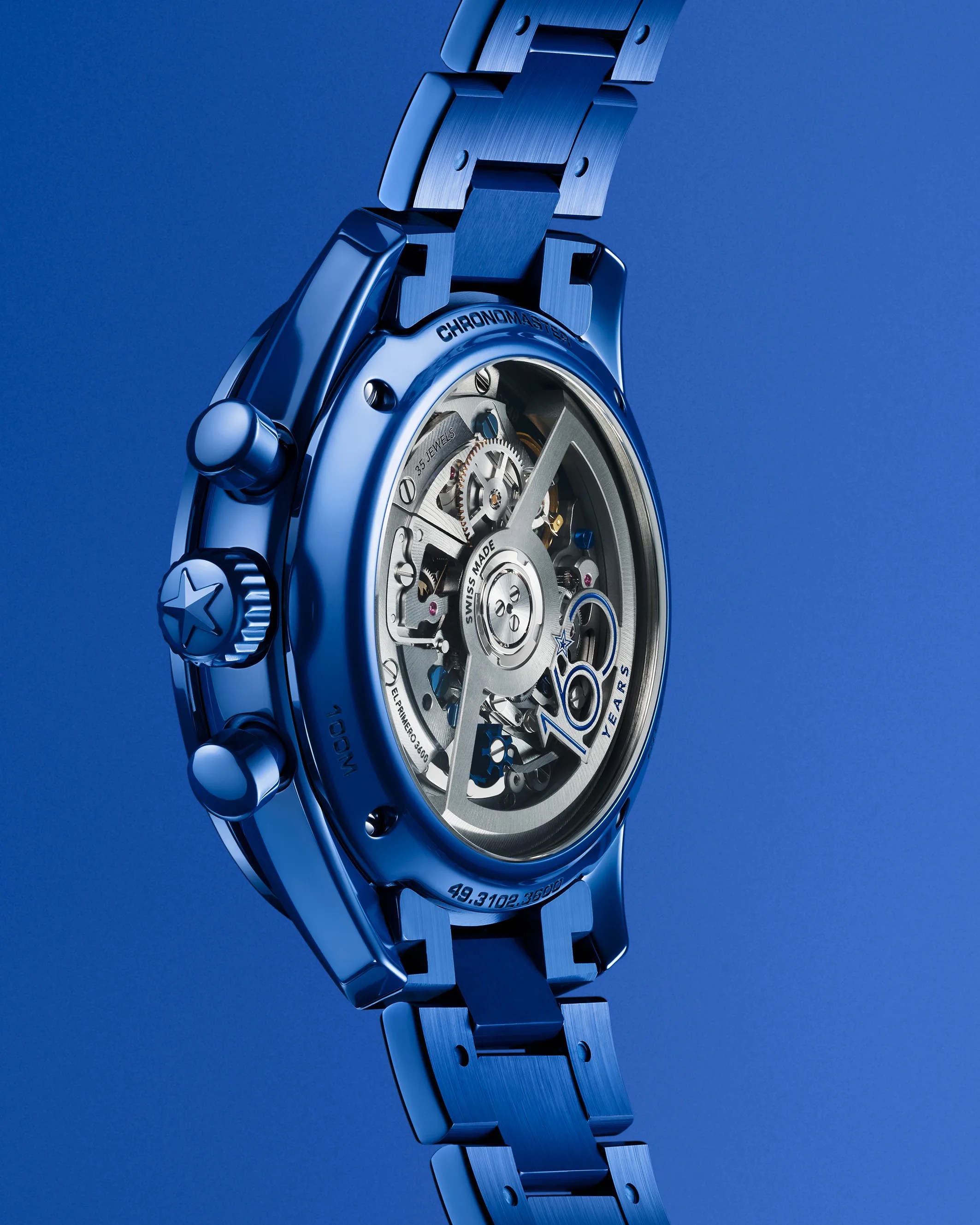the case back, crown and bracelet of a Zenith watch