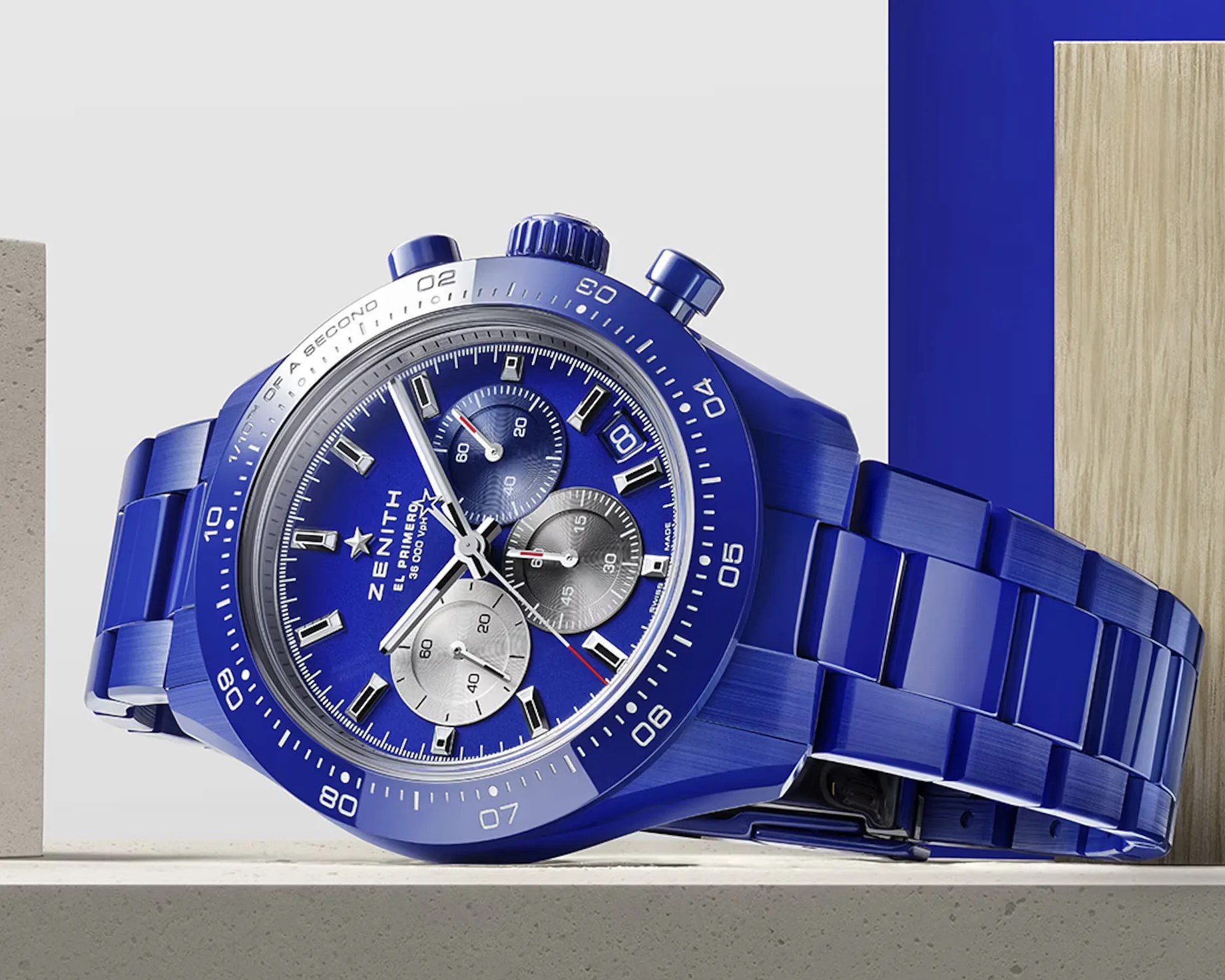 a blue Zenith chronograph watch