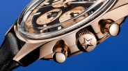 the crown and case of a rose gold watch
