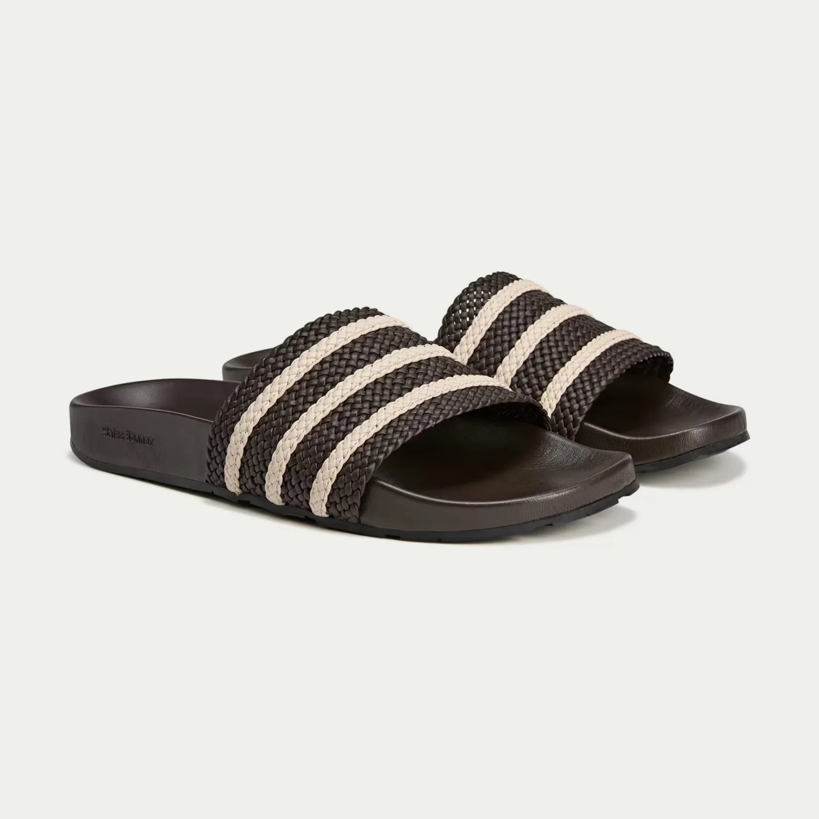 A pair of Wales Bonners Adidas Adilette slides in brown