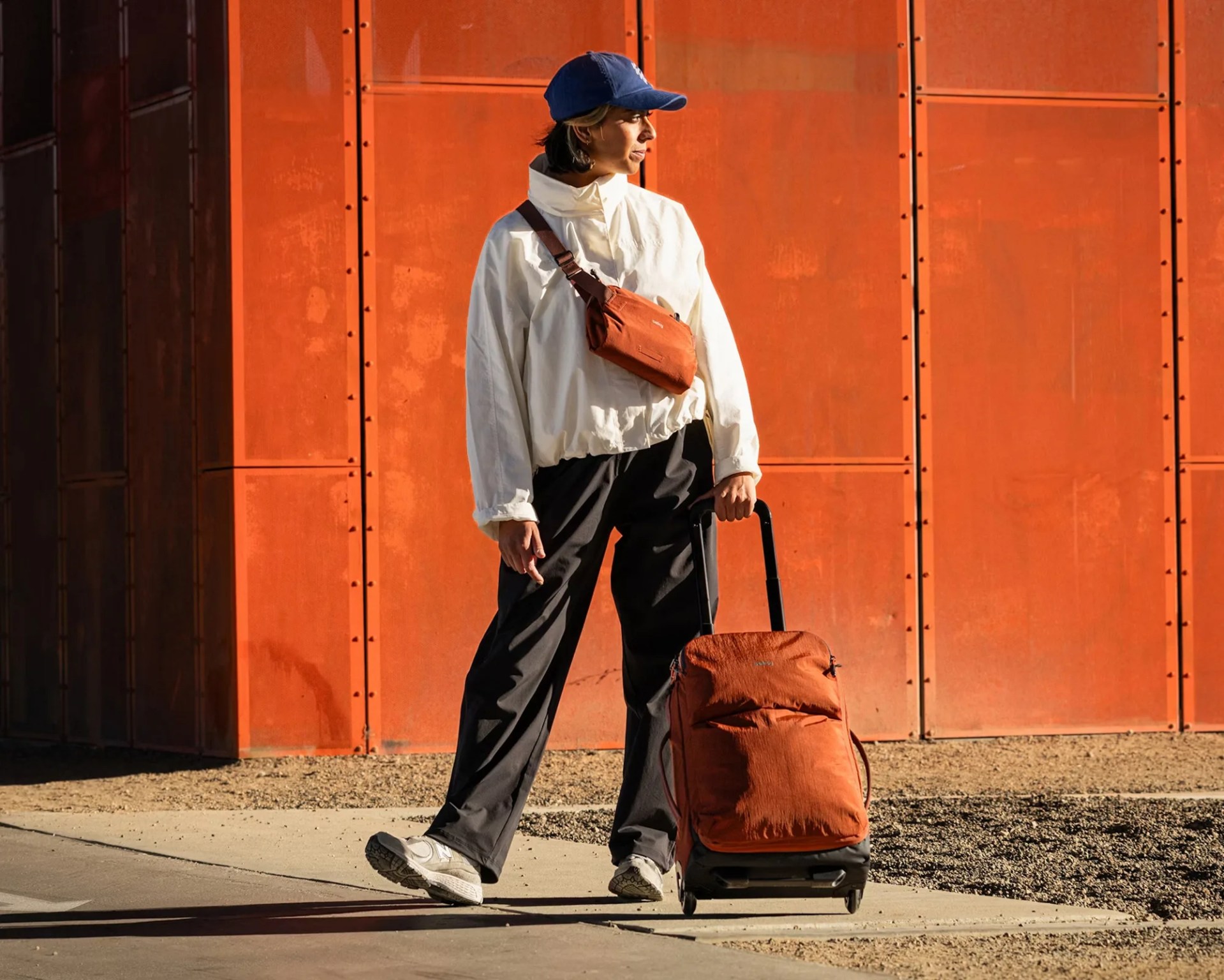 Bellroy Lite carry-on with model outdoors