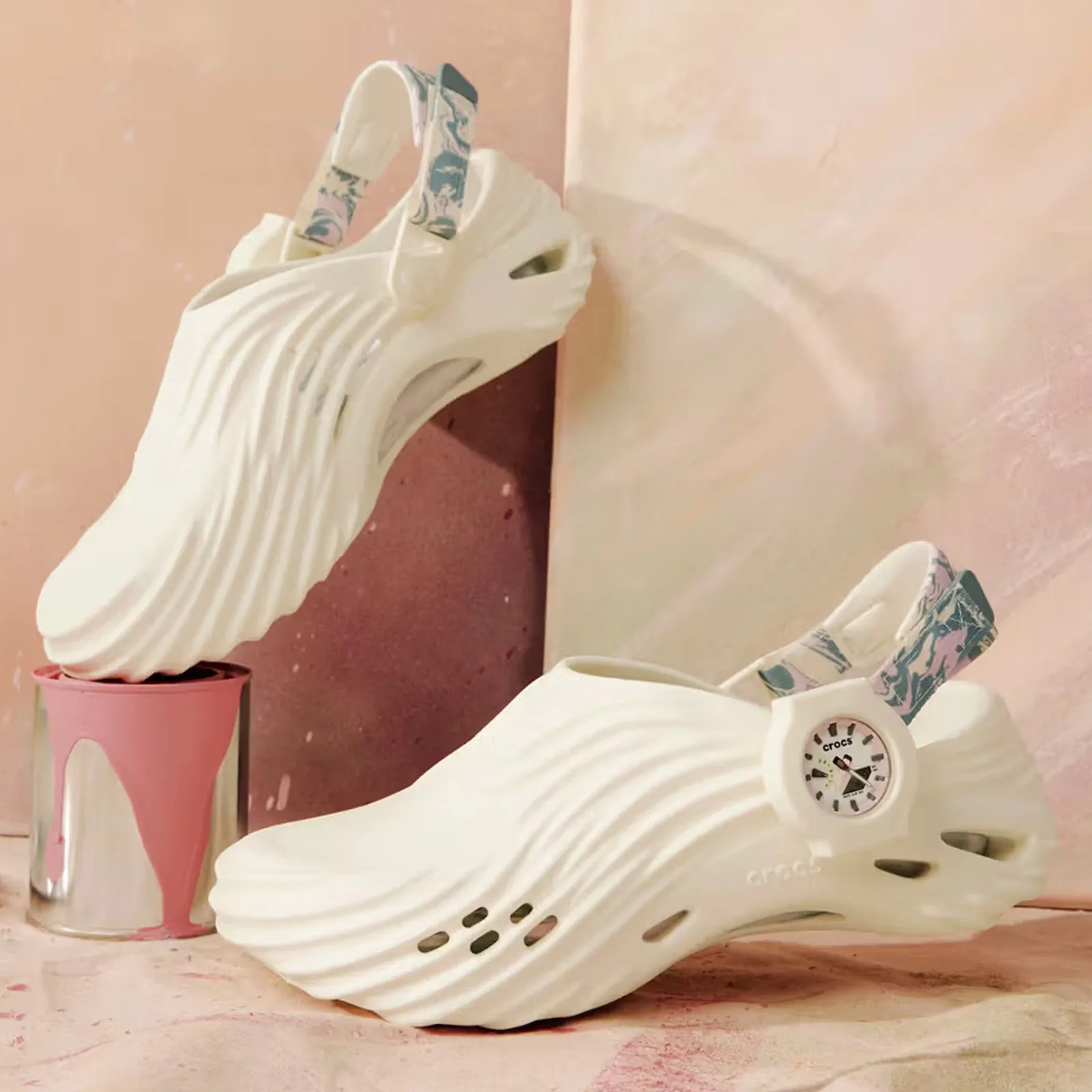 The G-SHOCK x Crocs Echo Wave Bundle shown in profile with one shoe on the ground and the other elevated above.