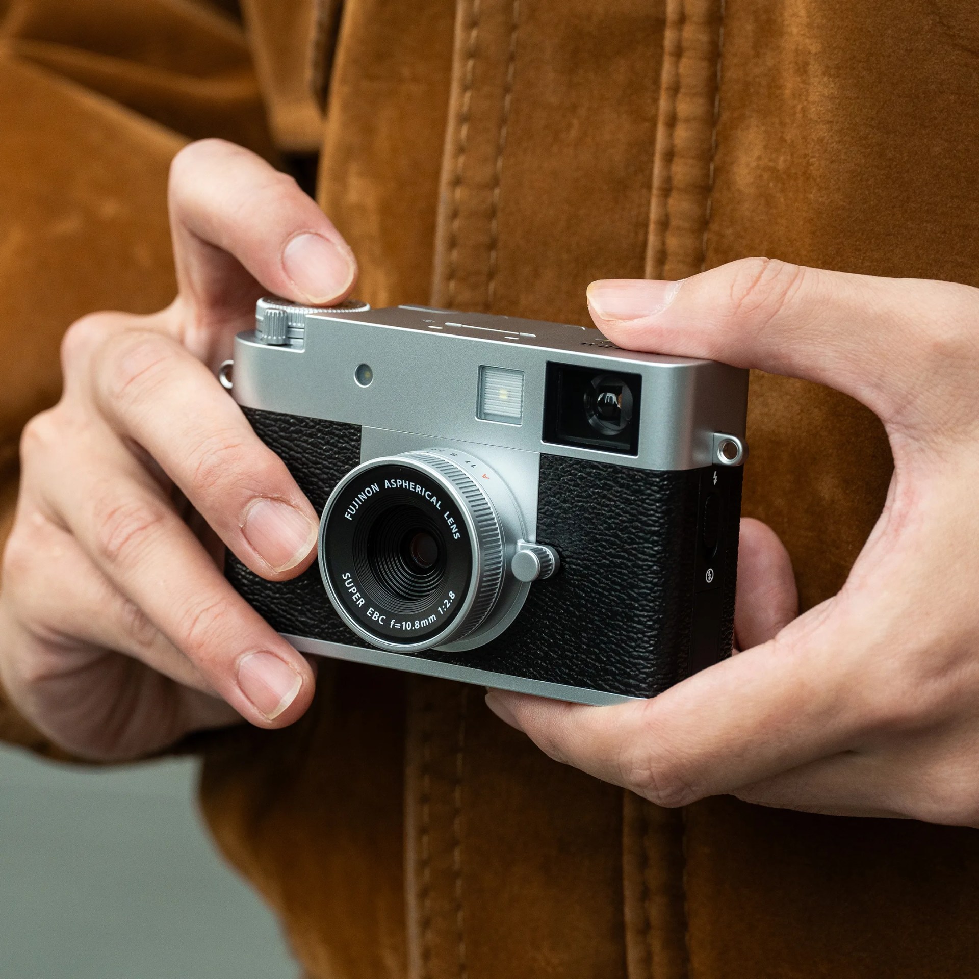 Fujifilm X Half camera in hands