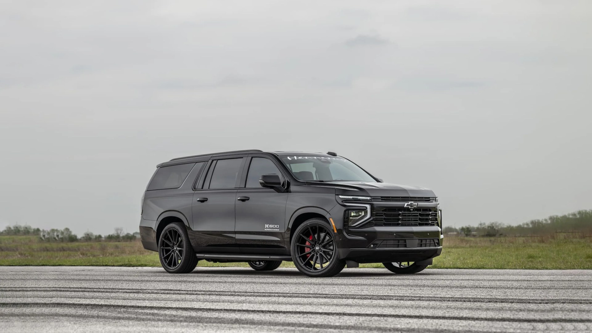 Hennessey Performance H600 Suburban in black shown driving on asphalt pointing to the right