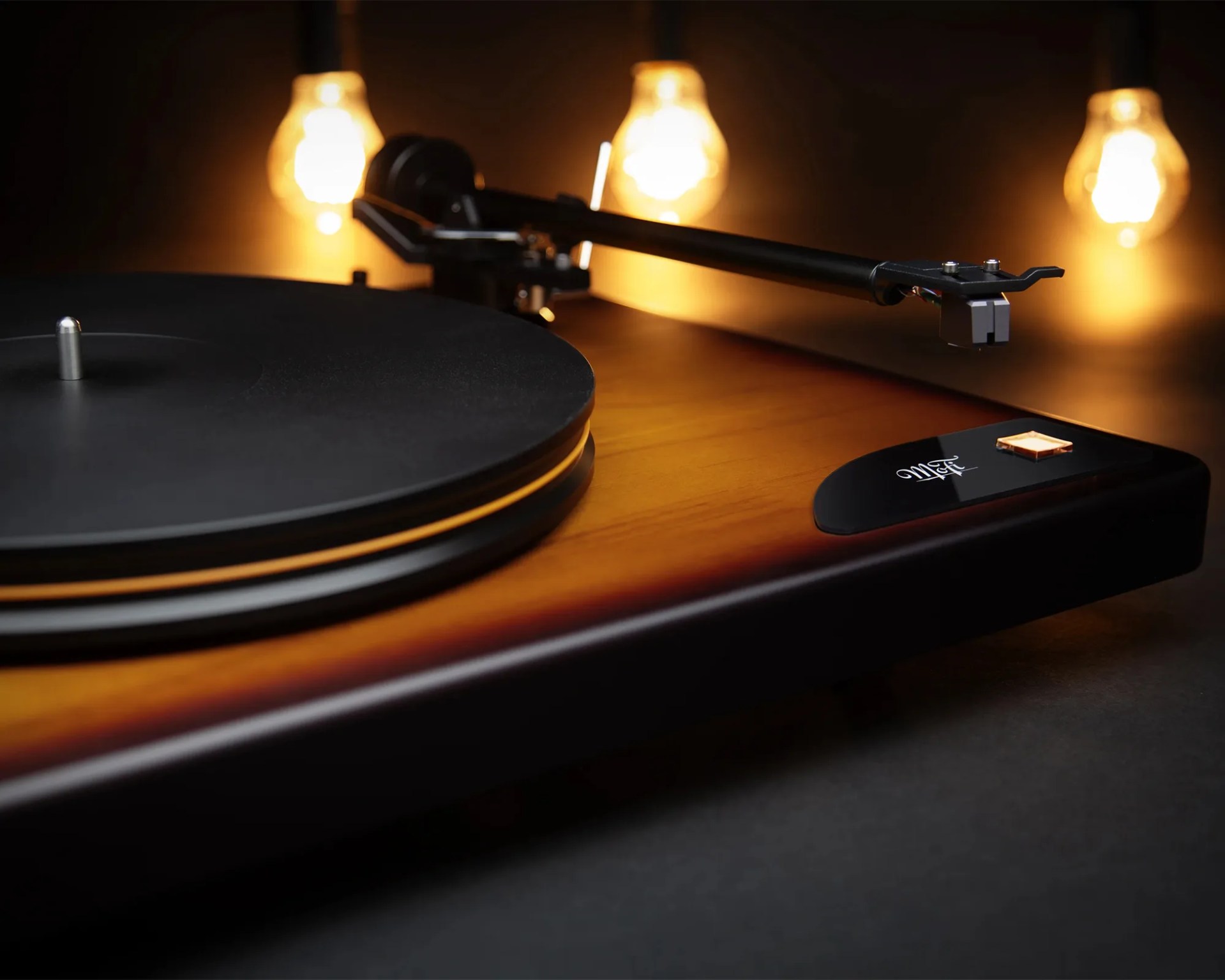 MoFi Electronics x Fender American Vintage Turntable closeup in front of lamps