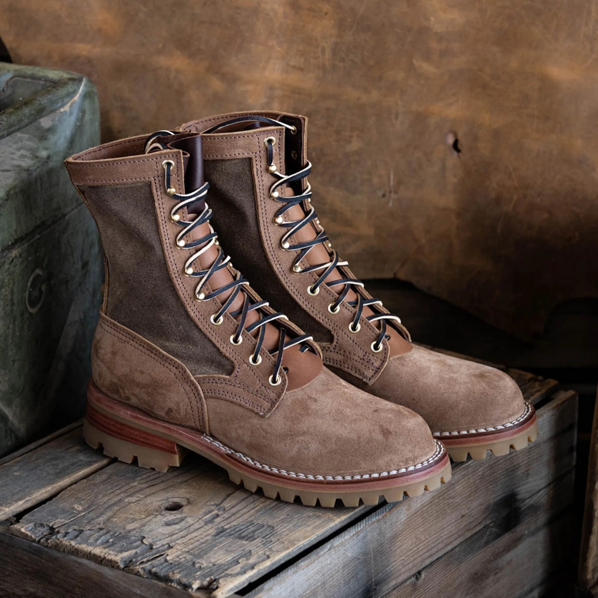 Nicks x Heat Straps UpperDucker Boot on wood box in front of canvas