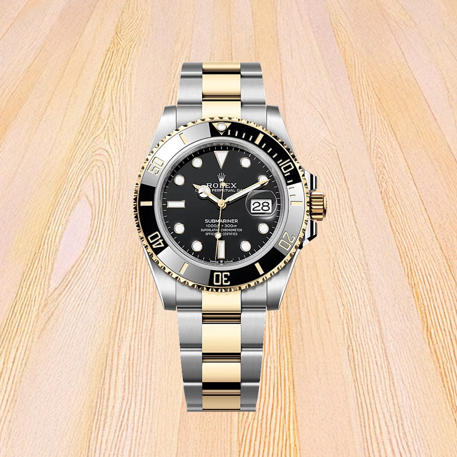 A two-toned Rolex Submariner with a Black face shown against a light wood background. 