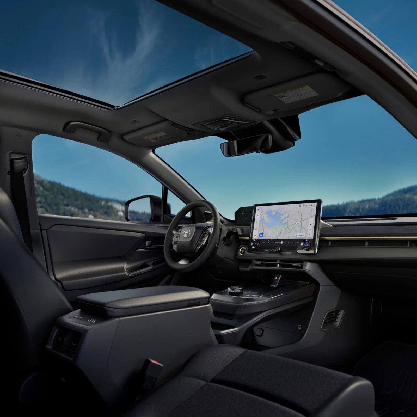 An image of the Toyota bZ Woodland interior shown from below the passenger seat looking up at the windshield and driver's seat. 