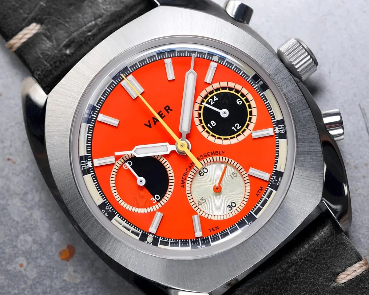 a Vaer chronograph with an orange dial