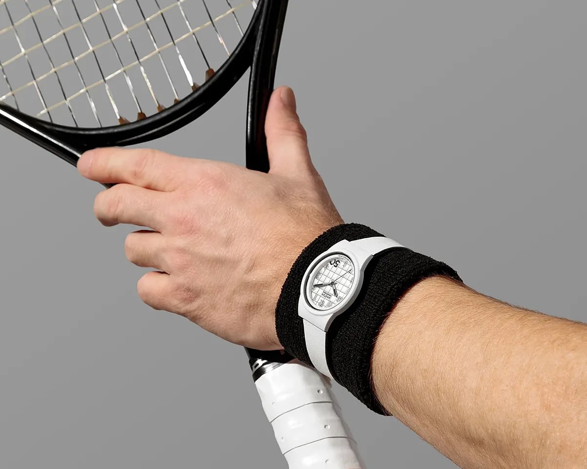 a white watch on a man's wrist