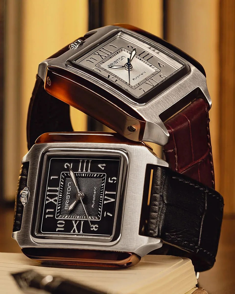 two square dress watches next to each other