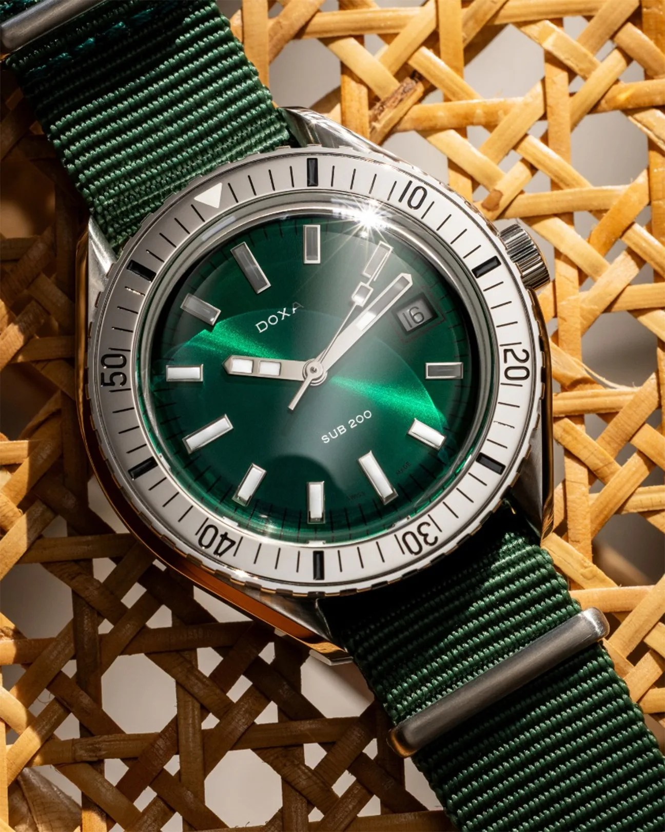 a green dial Doxa dive watch with a steel bezel