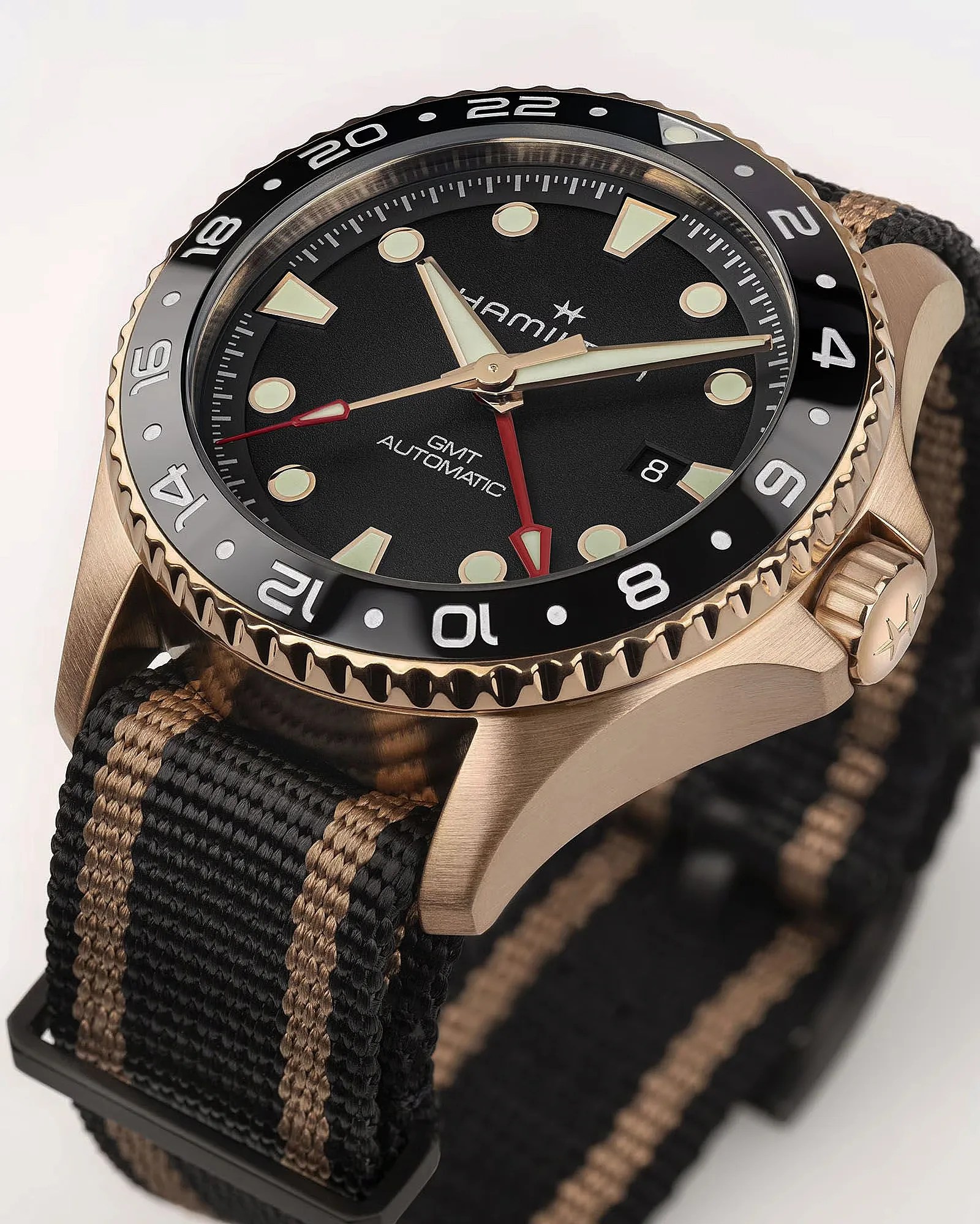 a bronze Hamilton dive watch with a nylon strap