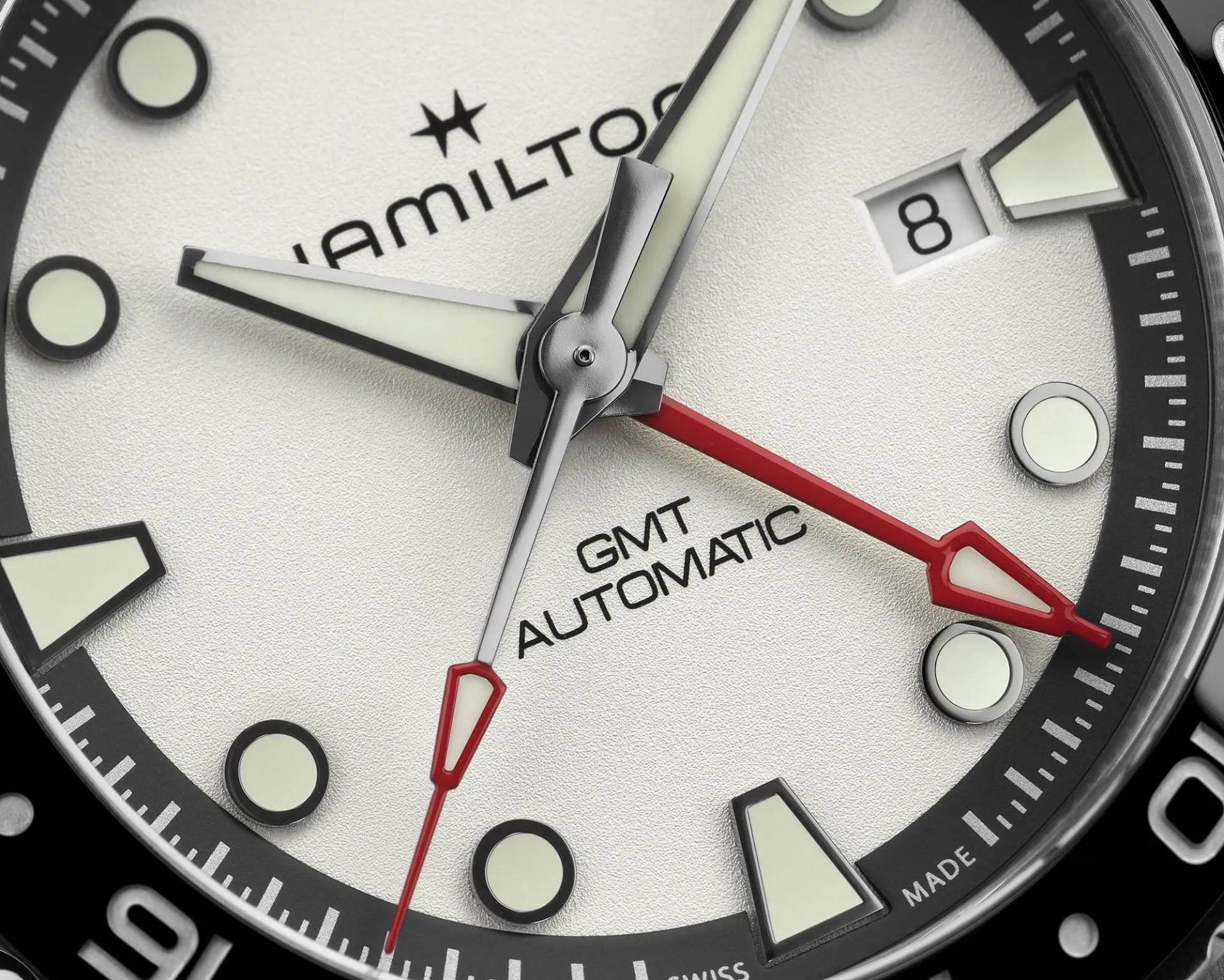 the dial of a Hamilton GMT dive watch