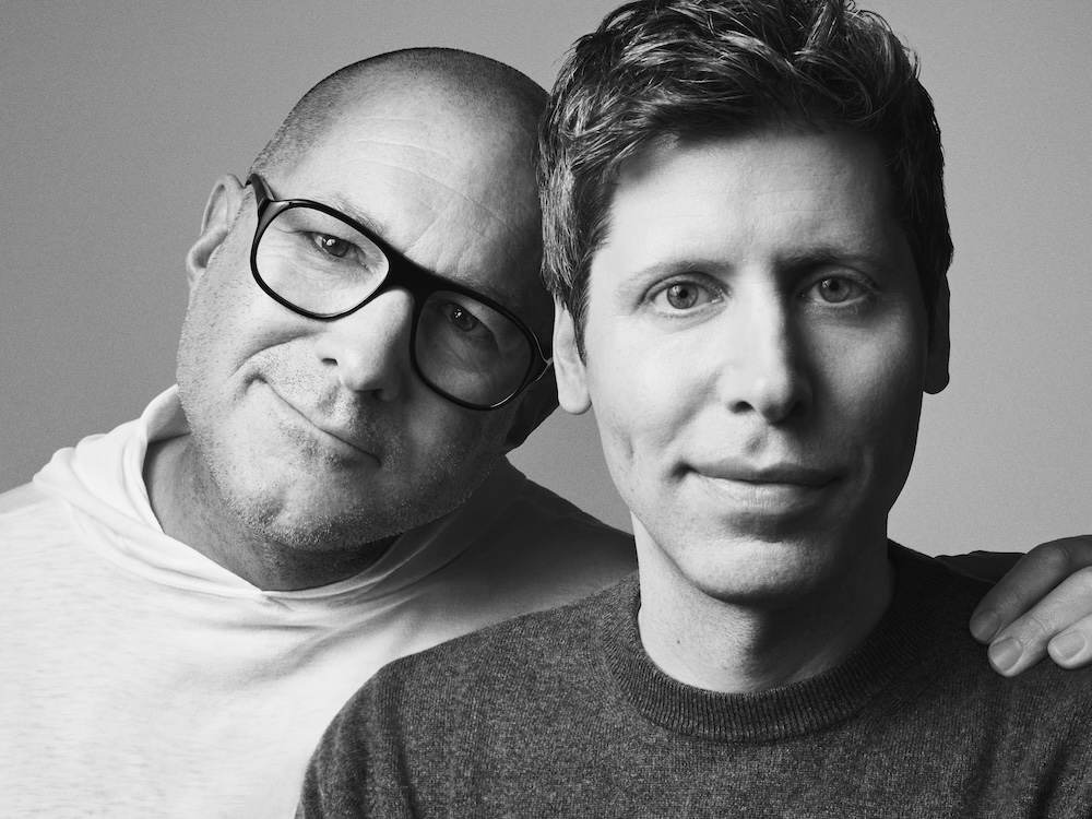 A portrait of Jony Ive and Sam Altman in black and white. Jony Ive is shown with his arm wrapped around Altman and his hand on his shoulder. 