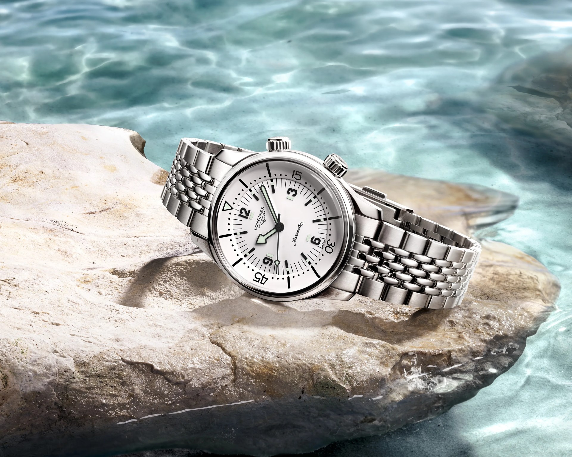 a longines dive watch on a rock